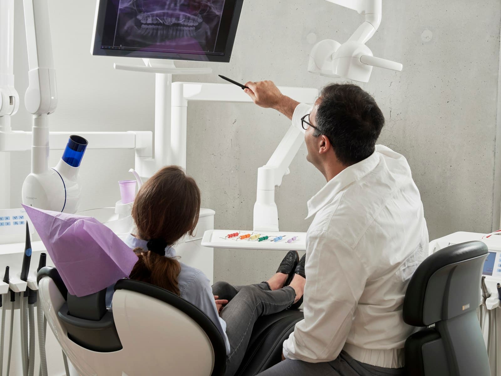 A dentist treating a patient in a modern surgery