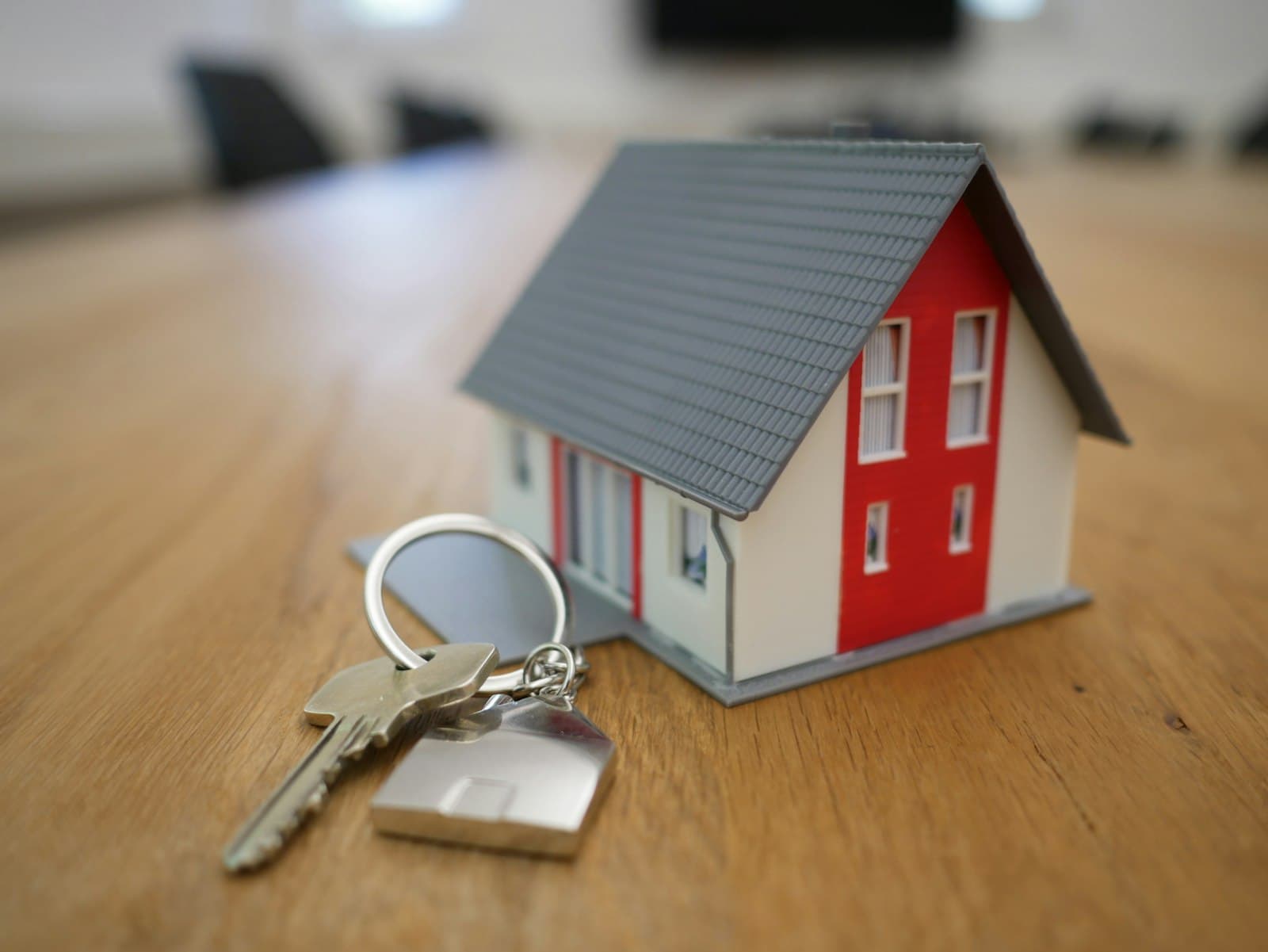 A model house next to a set of keys